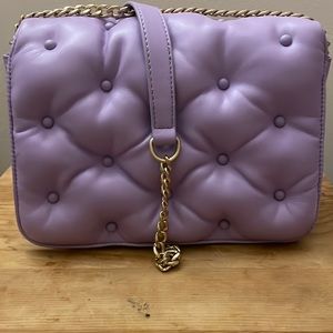 A Betsey Johnson light purple quilted chained purse!